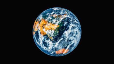 A view of Earth from space showing Asia, Australia, and parts of Europe and Africa against a black background.